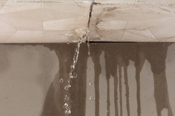 Professional Flood Damage Cleanup technician working in Long Beach, MS